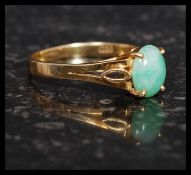An 18ct gold and jade ladies ring.