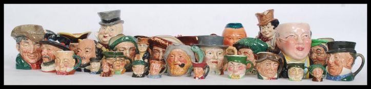 A large collection of character jugs to include Royal Doulton and many others in varying sizes.
