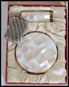 An early 20th century cased ' Melissa ' ladies mother of pearl tiled compact and lipstick holder.