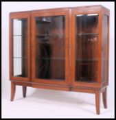 A stunning mid 20th century solid  oak display cabinet, having a central glass door,