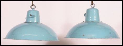 A pair of rare light blue and white mid century factory Industrial pendant lights having rope ties