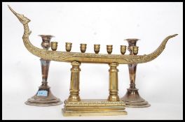 A stunning candelabra ( Menorah ? )  with room for seven candles along with a pair of silver on