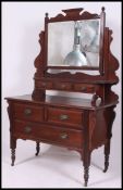 An Edwardian mahogany dressing table chest of drawers. Raised on turned legs with ceramic castors.