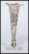 A 20th century white metal (does test as silver) unmarked Chinese oriental dragon vase,