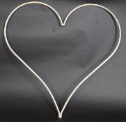 A large cast iron shabby chic heart.