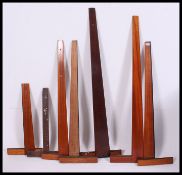 A collection of vintage draughtmans set squares,