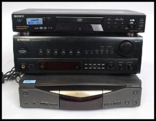 A Pioneer stereo Receiver SX-203RDS receiver along with Kenwood CD player and a Sony DVD / CD /