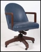 A 1950's mid century oak office swivel chair by Hillcrest.