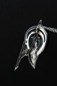 A contemporary silver Art Deco stylised figure set on a silver necklace chain. Total weight 6.