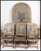 A large contemporary garden teak table with inset twin marble tiled centres complete with folding
