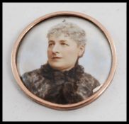 An unusual believed 19th century enamel minature portrait bust set within yellow metal surround.