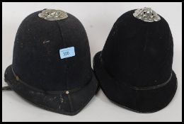 2 20th century policemans helmets ( see illustrations )