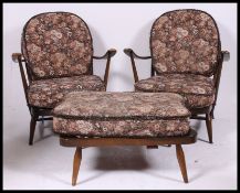 A pair of 1970's retro Ercol beech and elm Windsor pattern armchairs.
