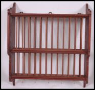 A 20th century country style pine wall mounted plate rack. The centre with spindle gallery supports.