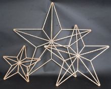 A set of 3 large cast iron shabby chic stars.