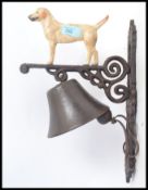 A 20th century cast metal wall hanging bell,