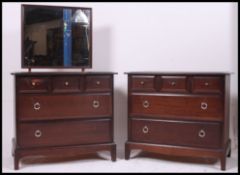 A Stag Minstrel three over two mahogany chest of drawers along with a matching dressing table chest