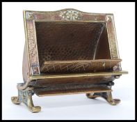 An unusual 20th century brass match striker in the form of a fire place marked for Cosmos Radiant