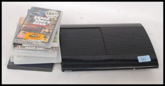 A Sony PS3 games console together with games.