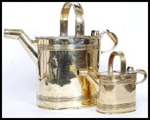 A Victorian Size 1 and Size 3 brass hot water cans ( 2 total ) each with ribbed detail and angular