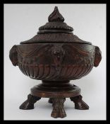 An unusual black forest carved wooden centrepiece / lidded fruit bowl.
