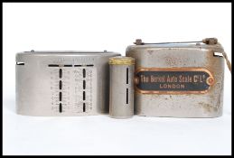 A collection of six home safes / money savings banks to include a  Berkel Auto Scale Company with