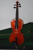 A cased violin by Skylark Brand being complete with the bow ( see illustrations ).