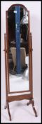 A mahogany framed cheval mirror having a  rectangular mirror raised on tapering supports and