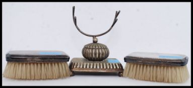 A Sterling silver 950 marked pair of clothes brushes together with a silver plate pen stand with