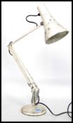 A 20th century Herbert Terry anglepoise lamp in white with circular base and pendant shade