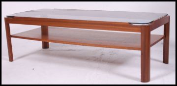 A retro 1970's teak and smoked glass rectangular coffee table.