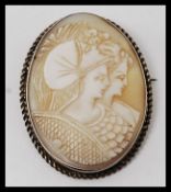 An excellent Edwardian silver ladies cameo with twin maidens to the agate stone centre with ribbed