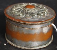 A fabulous copper and silver plated trinket box of cylindrical form having applied decorative top