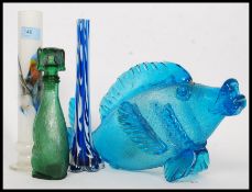 A collection of studio glass to include a fish, vases and a dog shaped glass decanter.