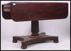 A Regency  mahogany sofa table . Raised on a quadruped column base with singe drawers to one end.