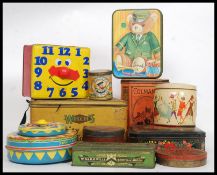 A collection of assorted vintage advertising tins to include Harrods, Clock Face,