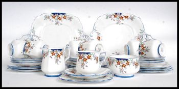 A stunning 1930's Art Deco handpainted part tea service in a chintz blue bell pattern  by Bell