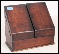 A Victorian oak Desk Tidy stationary cabinet Twin doors with appointed interior set within.