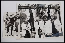 A Karl Denver signed publicity photograph bearing signatures of the band to verso.