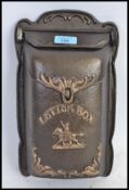 A cast iron 20th century letter box, with opening flap to top.