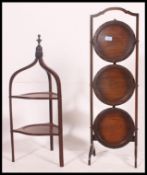 A Victorian mahogany bell shaped two tier cake / serving stand with turned  finial top,