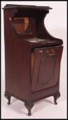 An Edwardian coal purdonium cabinet.