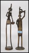 A pair of African cast bronze figures,