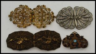A collection of antique and vintage belt buckles to include 3x full buckles,