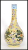An early 20th century imperial yellow ground bottle vase,