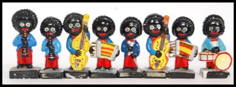 A collection of 8x vintage Robinsons Golly plaster band members.