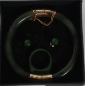 A beautiful jade Chinese and yellow metal bangle, ring and earring set.