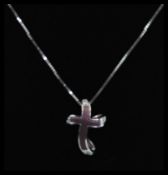An 18ct white gold crucifix cross and necklace chain. The top and cross with 1pnt diamonds.