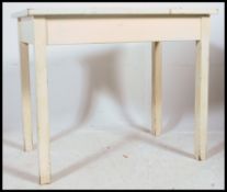 A retro mid century scrub top shabby chic painted pine kitchen table raised on squared legs