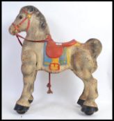 A vintage Mobo tinplate childs walking horse - with original Mobo label to front.